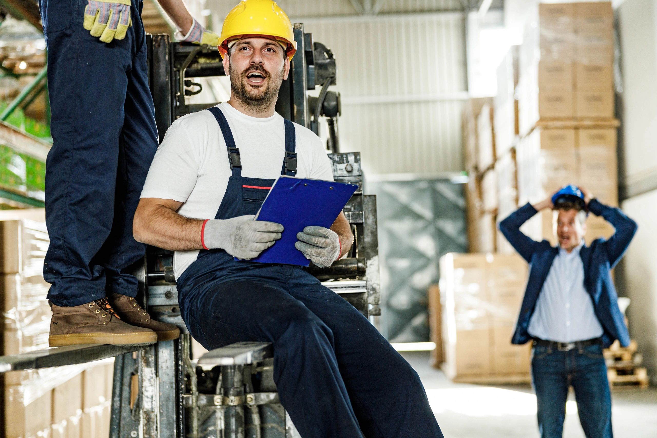 Professional movers handling boxes in a warehouse setting