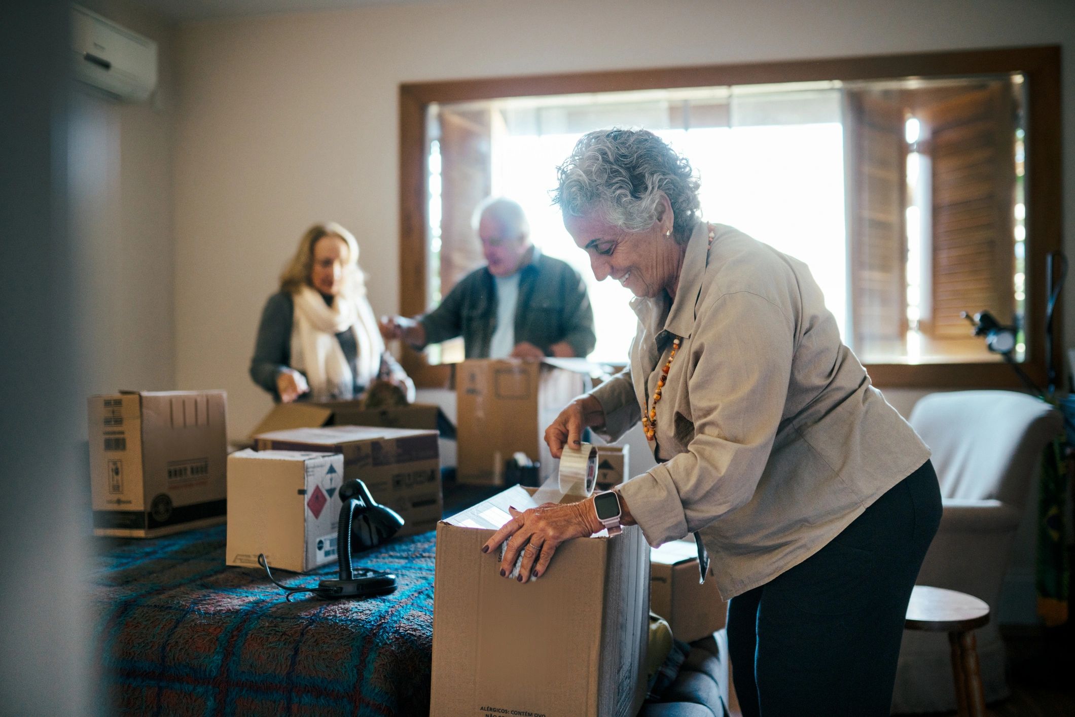 People unpacking boxes during a move