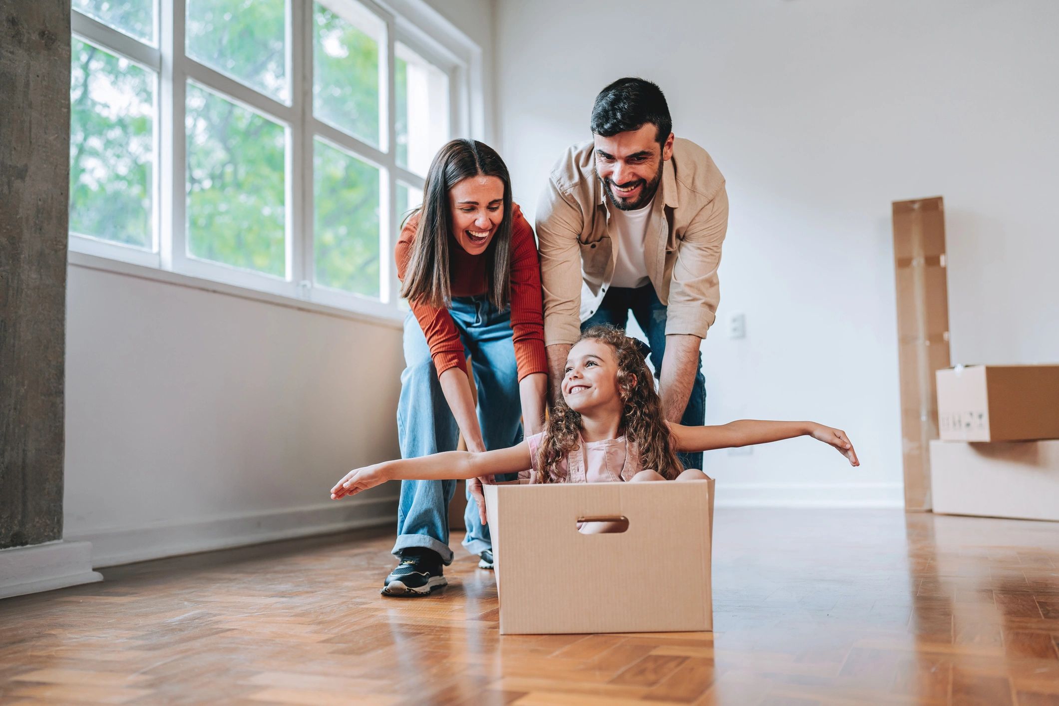 Family enjoying moving day in a new home